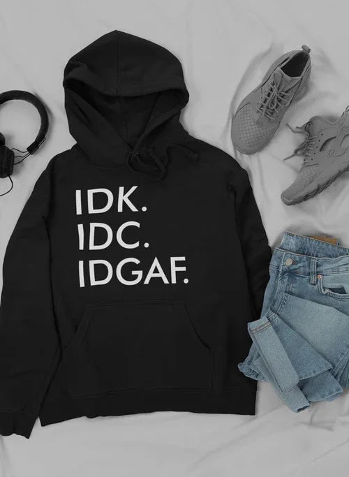 Pullover hoodie arranged with stylish sneakers and jeans, showing cozy fleece material.