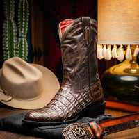 Man walking outdoors wearing Phoenix Aged Brown cowboy boots styled with casual outfit.