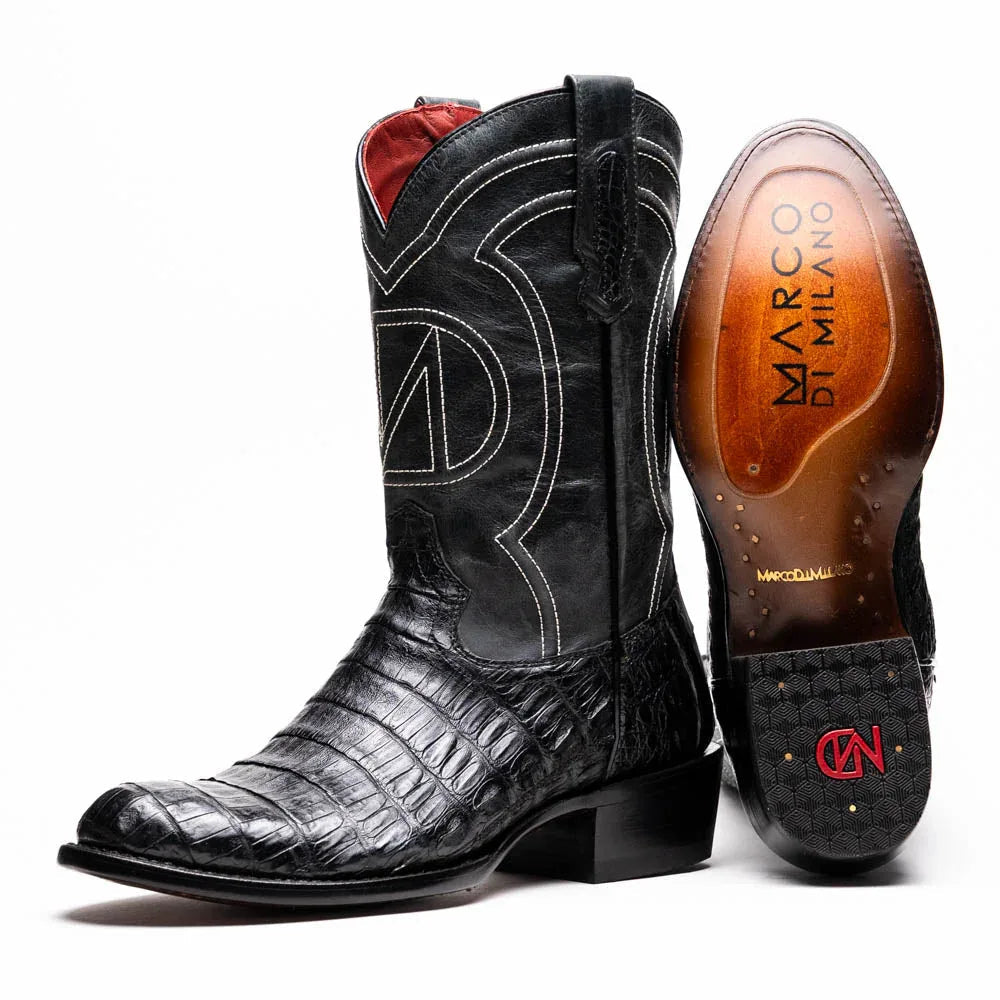 Close-up of black cowboy boot with genuine caiman belly skin texture and round toe
