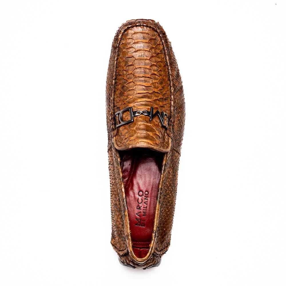 Angled shot of Pia Cognac driver shoe showcasing luxurious silhouette and craftsmanship.