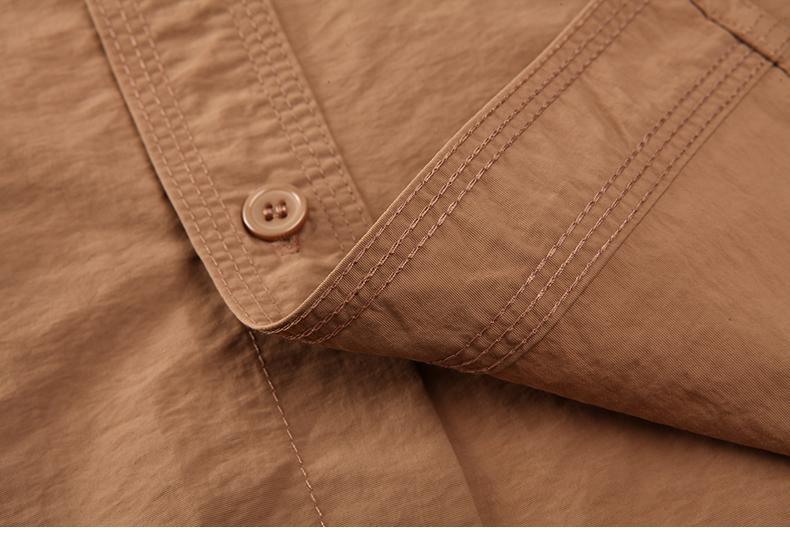 Folded tactical airsoft shirt in black color showing fabric texture and stitching.