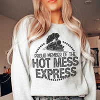 Peach-colored sweatshirt featuring white script text reading 'Proud Member Of The Hot Mess Express'.