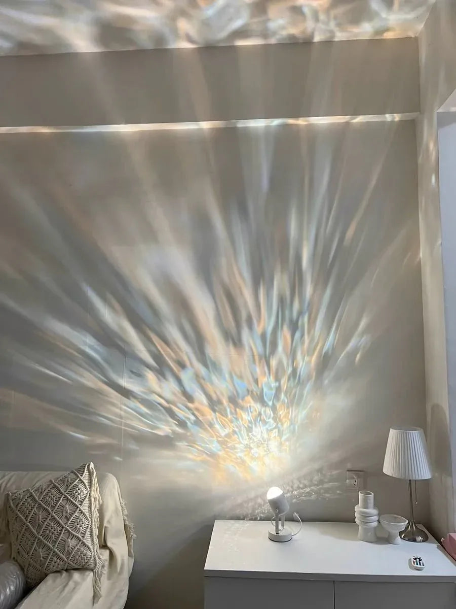 Modern ambient light projector casting blue ripple patterns on wall in low lighting.