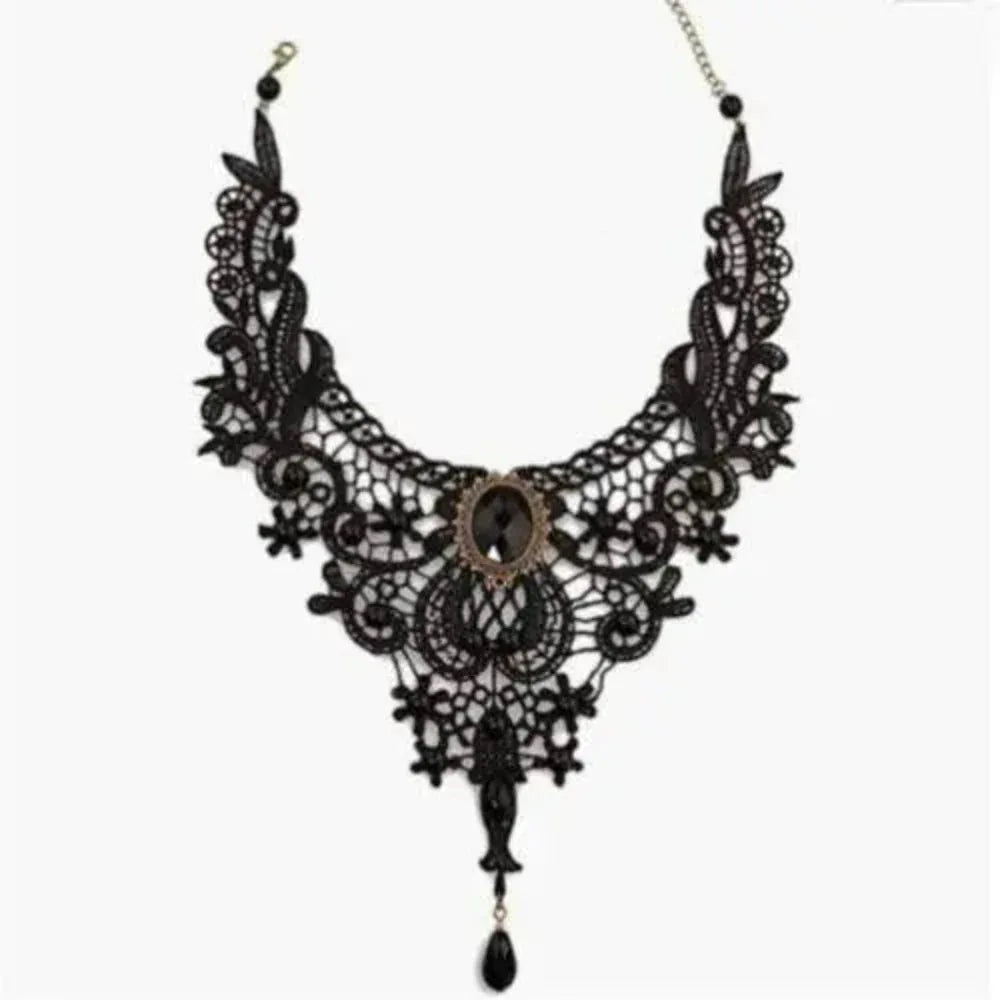 Model wearing black lace clavicular chain necklace with a strapless top.