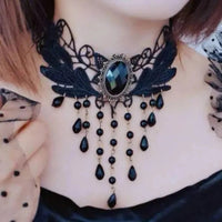 Black lace clavicular chain necklace laid out showing intricate floral lace design.