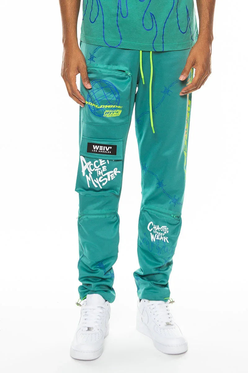 Sage green men's track pants with elastic waistband and visible zipper pockets