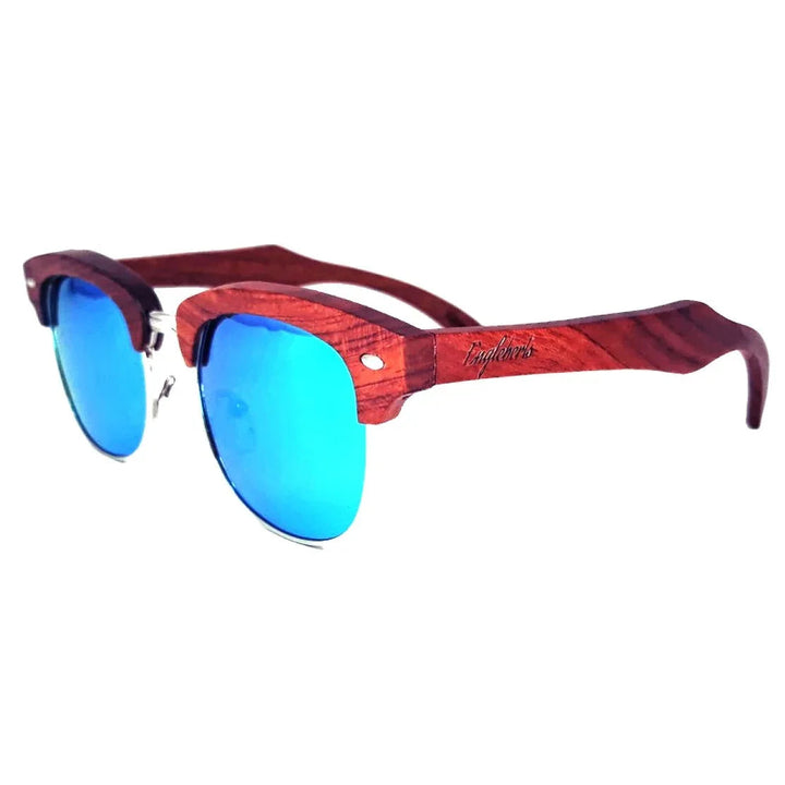 Close-up of Brazilian pear wood sunglasses with ice blue polarized lenses on white background.