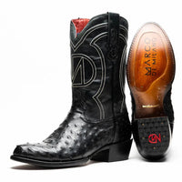 Close-up of black Savannah cowboy boot with full-quill ostrich skin and red vamp, side view.