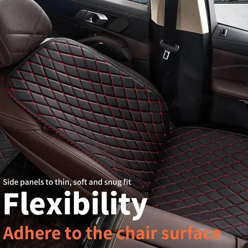 Close-up of black leather car seat cover with quilting and anti-slip breathable fabric details.