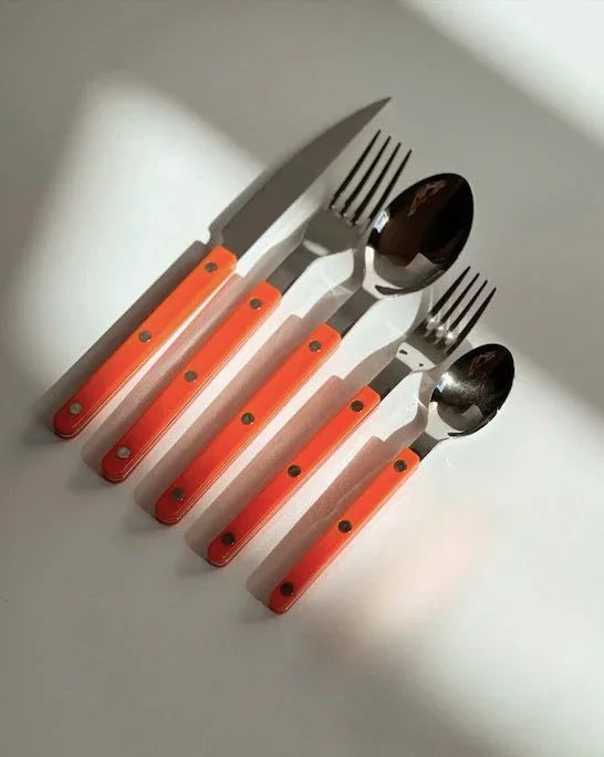 Side angle of dopamine cutlery set showing fork and spoon handles with a sleek finish.