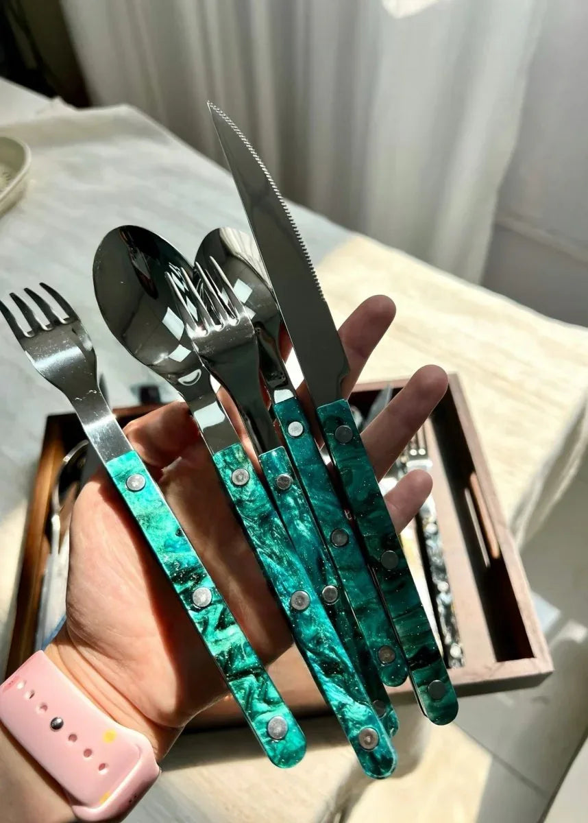 Flatware pieces arranged in a fan shape showcasing sleek modern styling