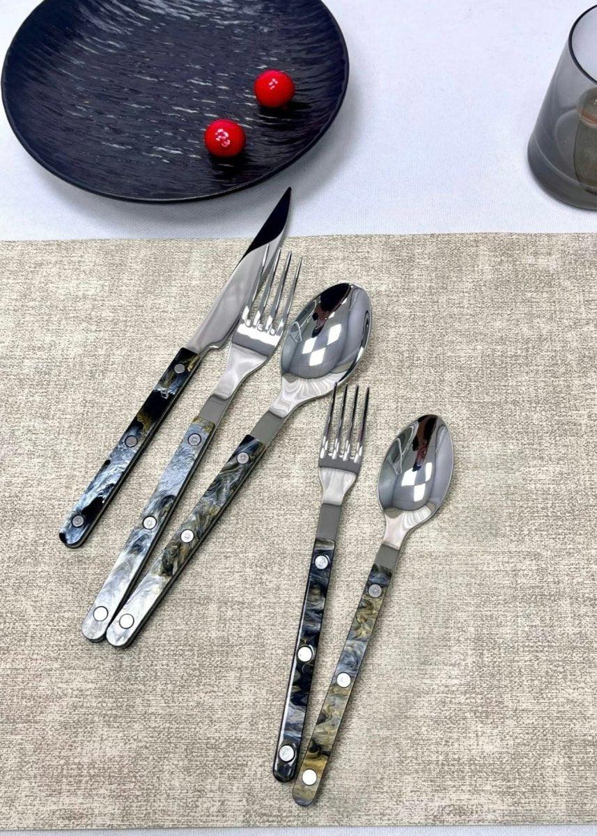 Close-up of modern elegant silver flatware with smooth matte finish