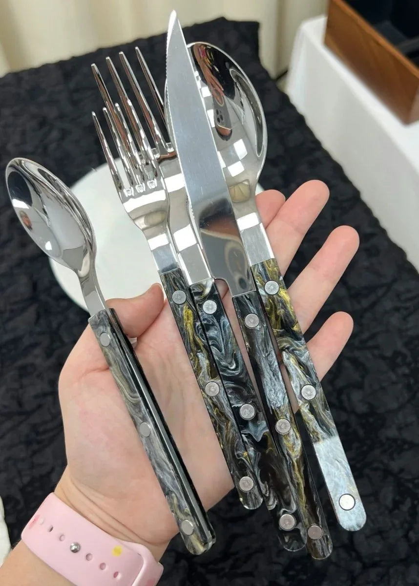 Detailed view of fork and spoon handles showing minimalistic design