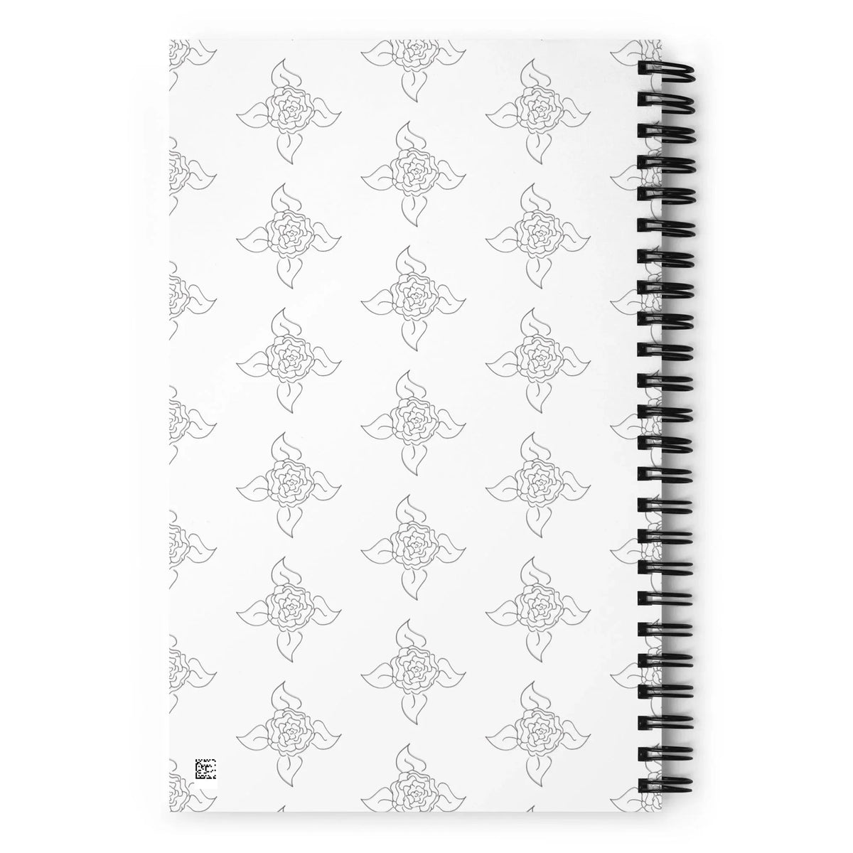 Back view of spiral-bound notebook showing orange cover and metal wire binding.