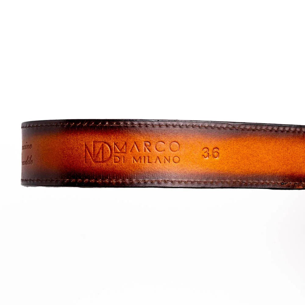 Texas Belt laid flat highlighting hot-stamped Marco Di Milano logo on calf leather and metal tip.