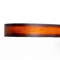 Texas Belt laid flat highlighting hot-stamped Marco Di Milano logo on calf leather and metal tip.