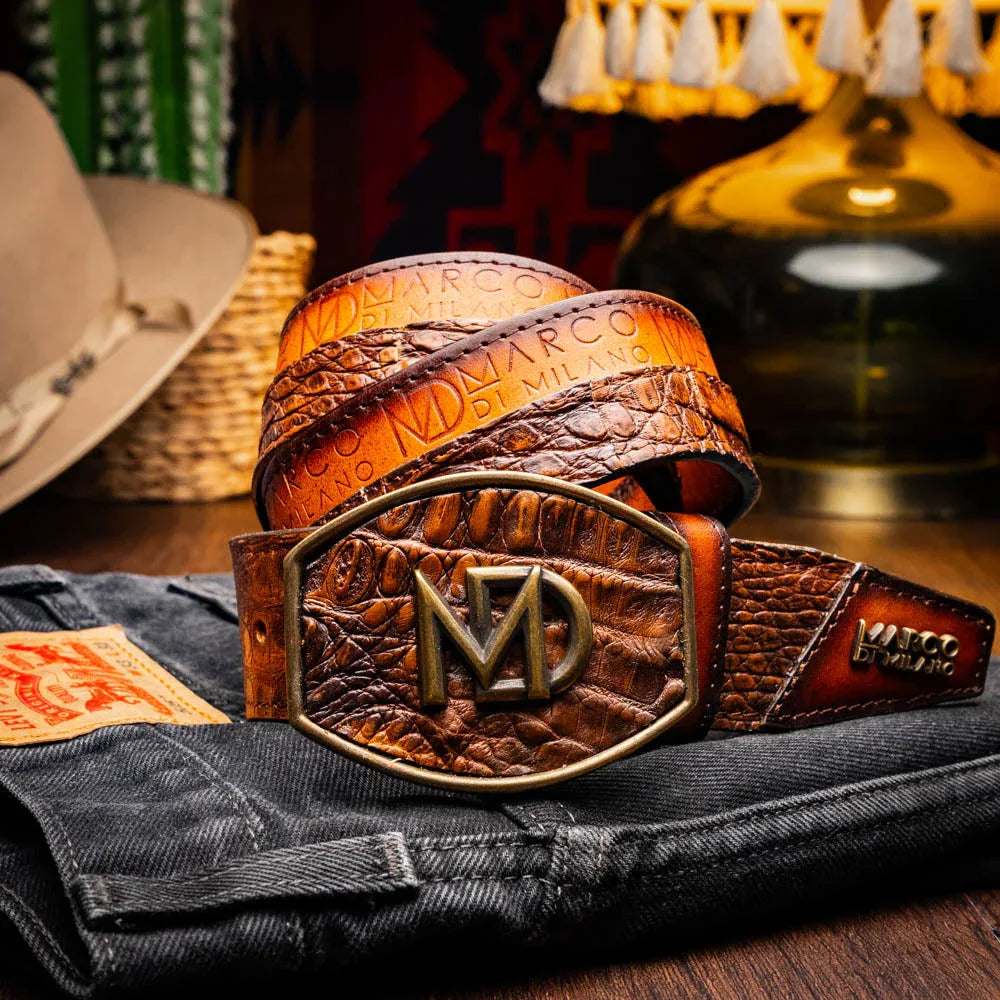 Model wearing Texas Western belt with caiman crocodile skin in aged maple, styled with jeans.