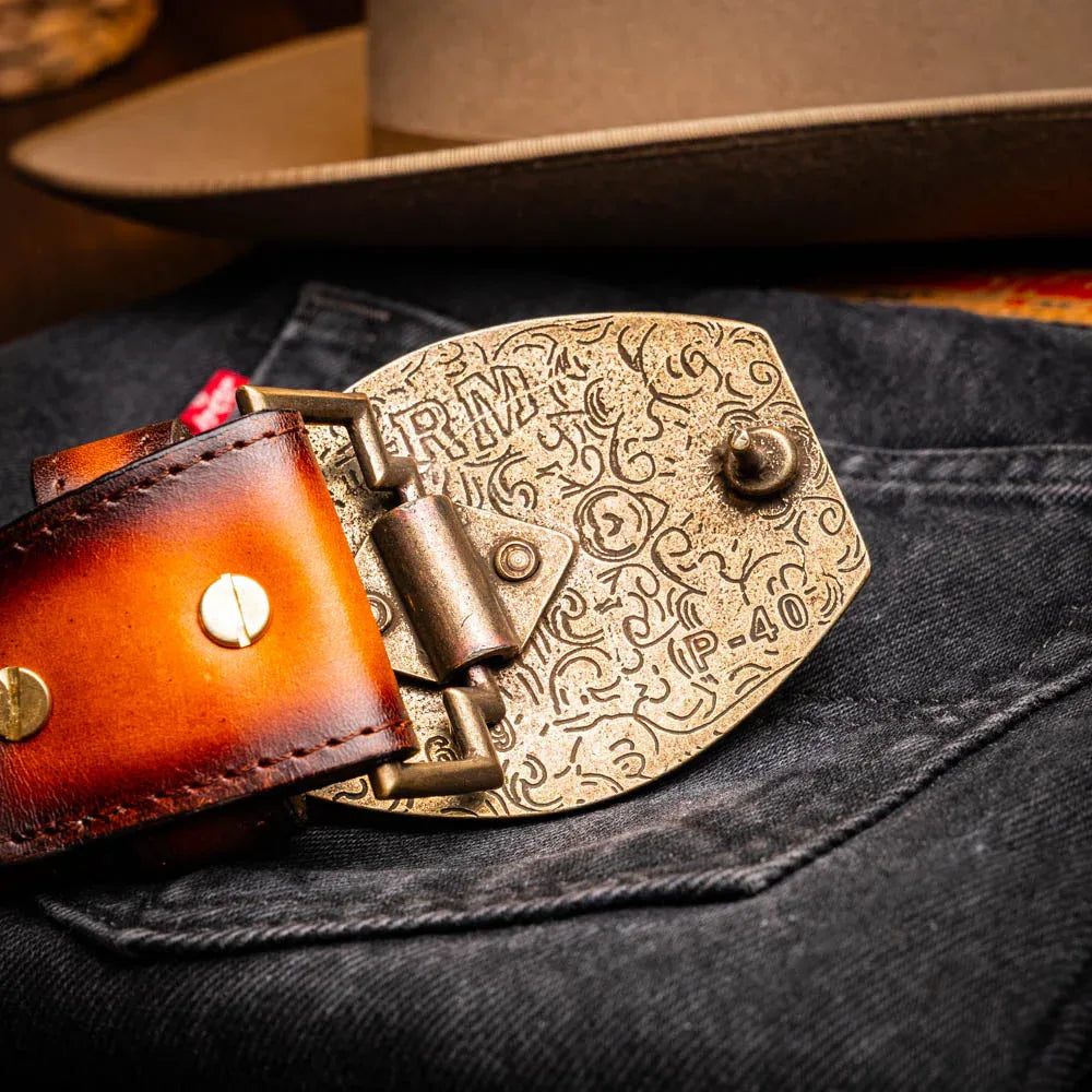 Lifestyle shot highlighting textured leather and antique buckle of Texas Western belt.