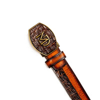 Texas belt showing detailed texture of caiman crocodile skin and calf leather with branded hot-stamp.