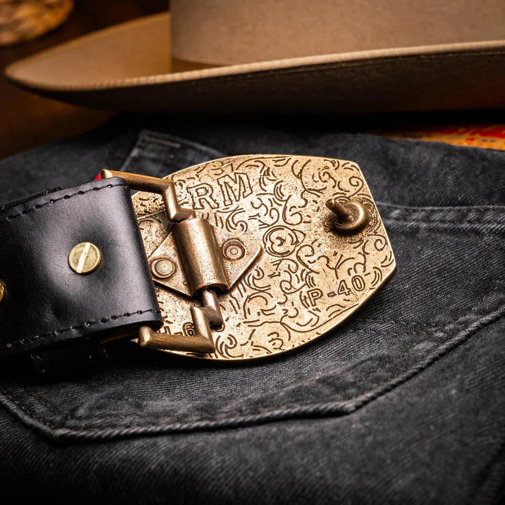 Side view of Texas Belt worn with rolled-up jeans highlighting belt details
