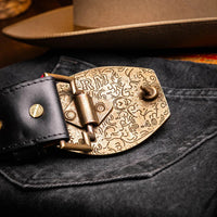 Side view of Texas Belt worn with rolled-up jeans highlighting belt details