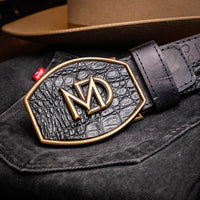 Close-up lifestyle shot featuring Texas Belt on model with rustic background