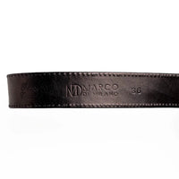 Detailed shot of Texas Belt’s antique-finish western buckle and textured caiman crocodile leather
