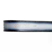Detailed image of antique-finish Western belt buckle and textured leather on gray Texas belt.