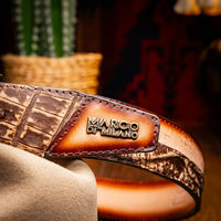 Close-up lifestyle image of Texas Belt worn with jeans, focusing on textured crocodile pattern.