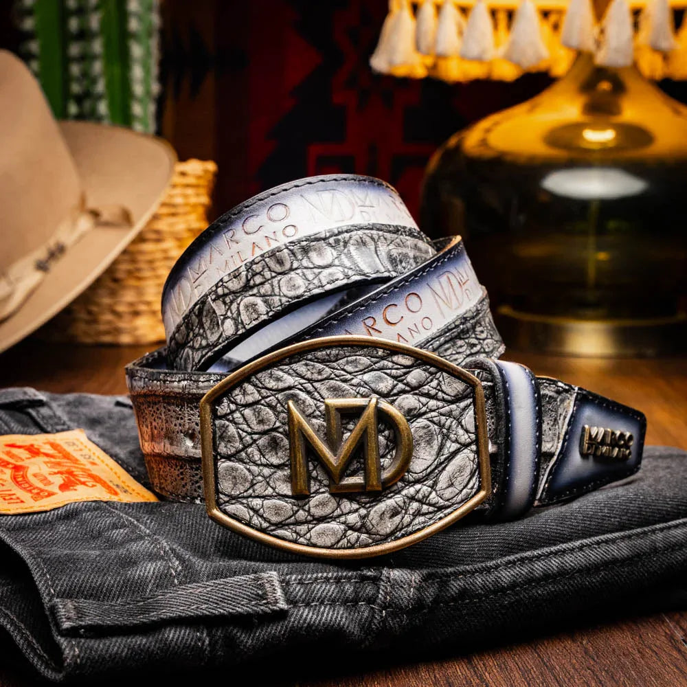 Lifestyle shot of model wearing gray Texas caiman and calfskin belt with Western buckle.