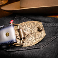 Casual outfit featuring Texas stone gray belt complementing denim and boots.