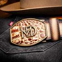 Model close-up showing textured caiman leather and antique buckle of Texas stone orix belt.