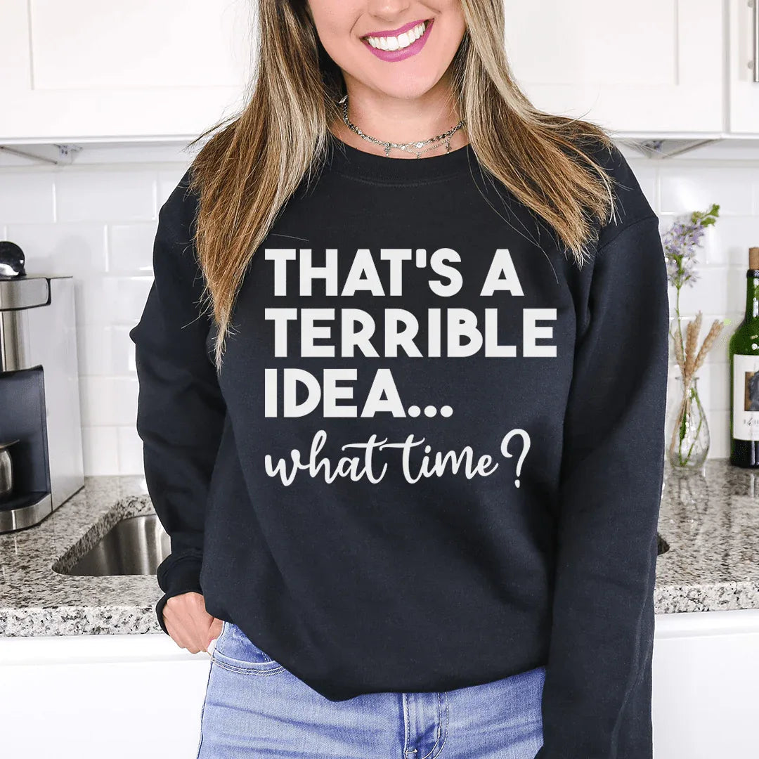 Peach colored sweatshirt with 'That's A Terrible Idea' text design on front.