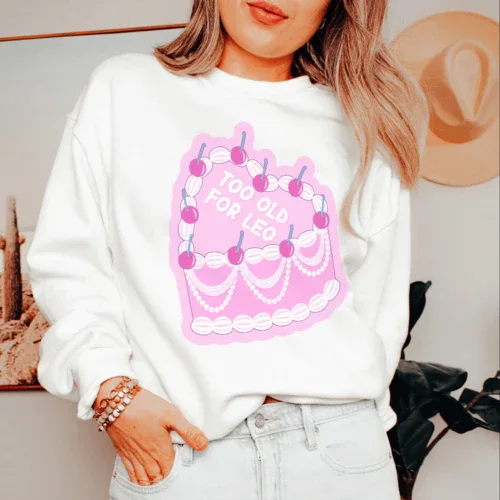 White sweatshirt with 'Too Old For Leo' design, soft fleece interior, adjustable banded cuffs