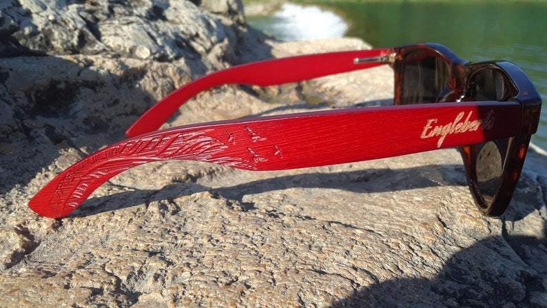 Side angle of tortoise patterned bamboo framed sunglasses highlighting temple design.