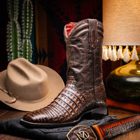 Casual outdoor scene featuring Tucson aged brown cowboy boots styled with denim jeans.