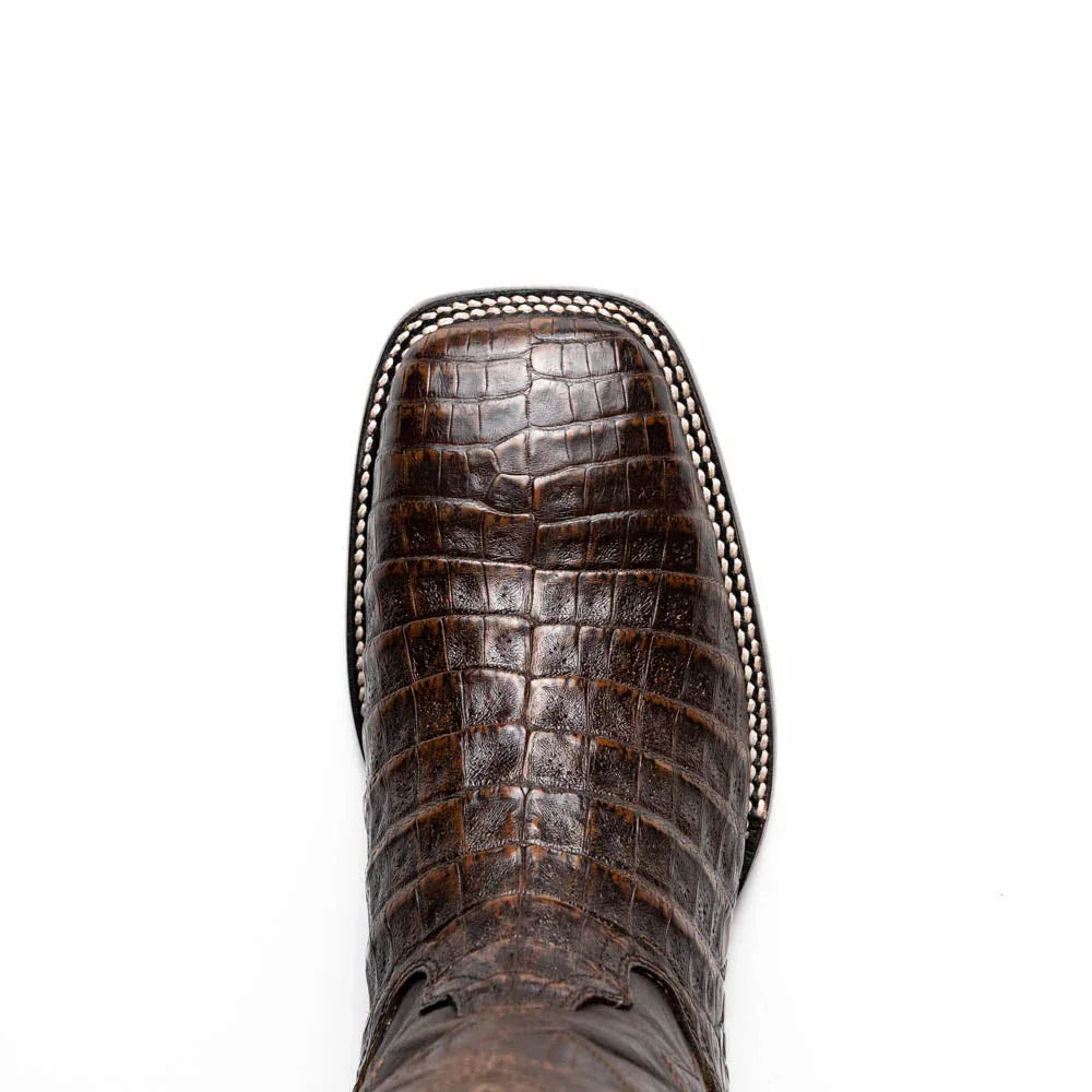 Close-up of rustic textured leather and stitching on aged brown Tucson caiman belly skin boot.