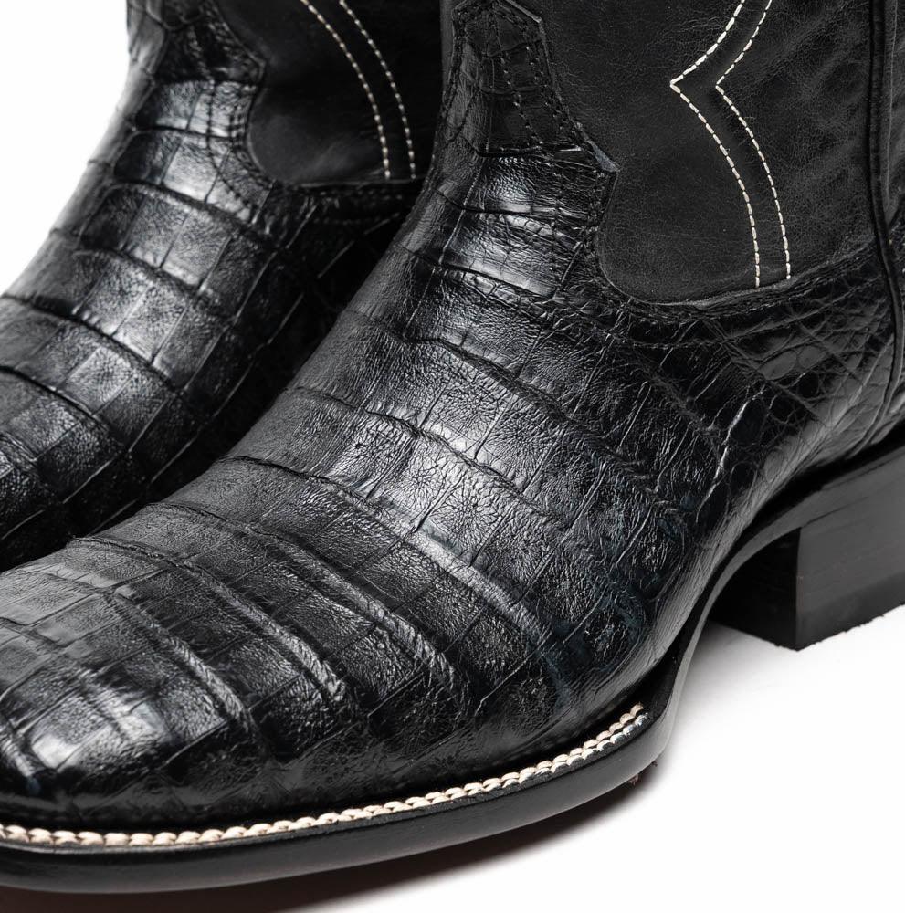Close-up of the boot's upper showing detailed texture and craftsmanship in black caiman skin.