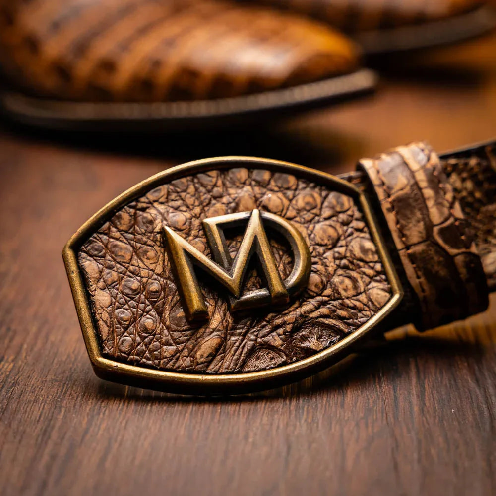 Lifestyle image of man walking wearing Tucson Stone Brown caiman belly skin cowboy boots with jeans.
