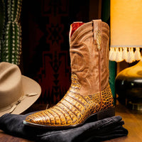 Man wearing Tucson Mustard Brown cowboy boots with jeans in an urban street setting.
