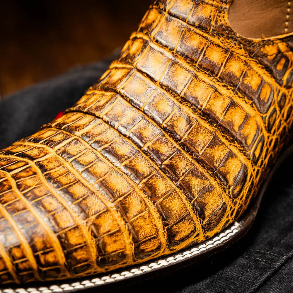 Close side view of Tucson Mustard Brown cowboy boot highlighting textured caiman belly skin.