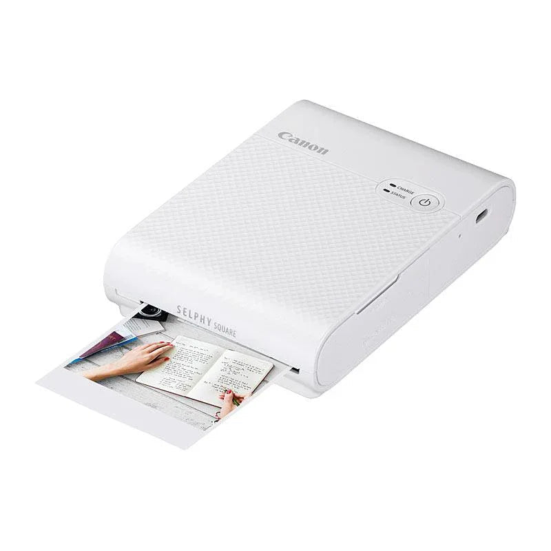 Canon Selphy QX10 compact white photo printer angled view on white background
