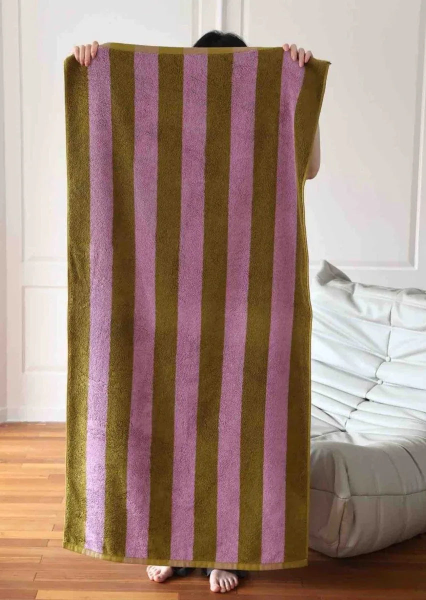 Close-up texture of 100% organic cotton bath towel with wide multicolor stripes.
