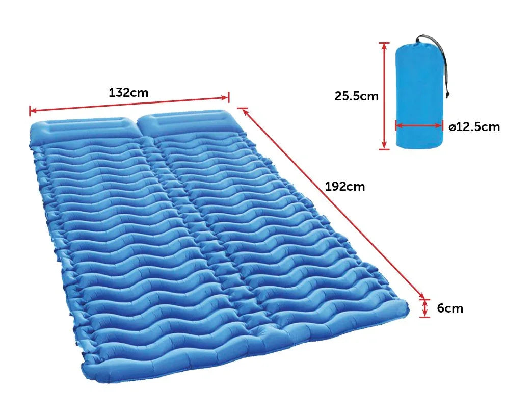 Carrying bag for double two-person camping sleeping pad displayed on wooden floor.